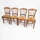 4 rustic farmhouse chairs made of wood and straw