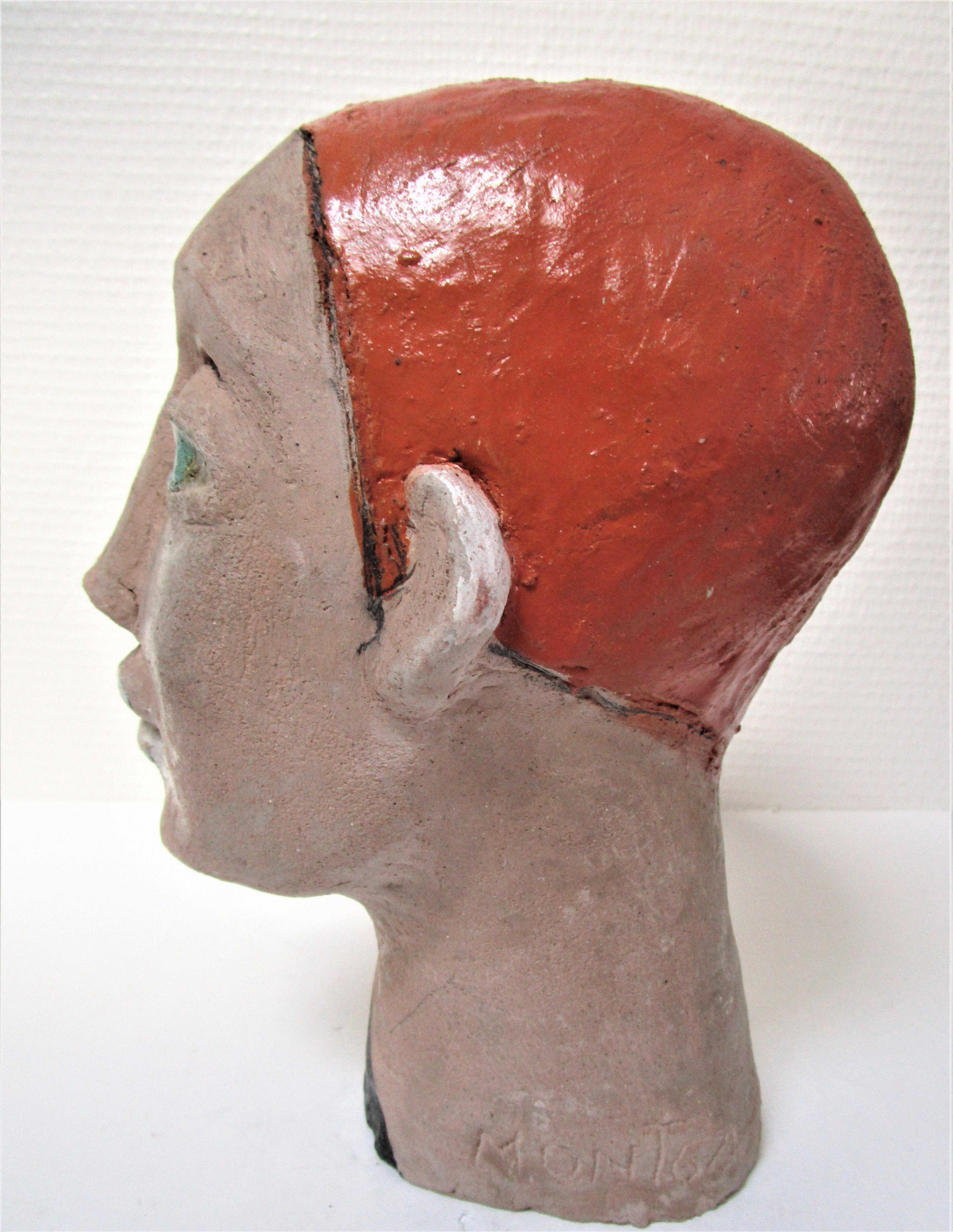 Redheaded boyish woman modeled in earth signed 60/70 years