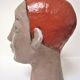 Redheaded boyish woman modeled in earth signed 60/70 years