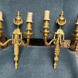 Pair of wall lights. Solid gilded bronze.