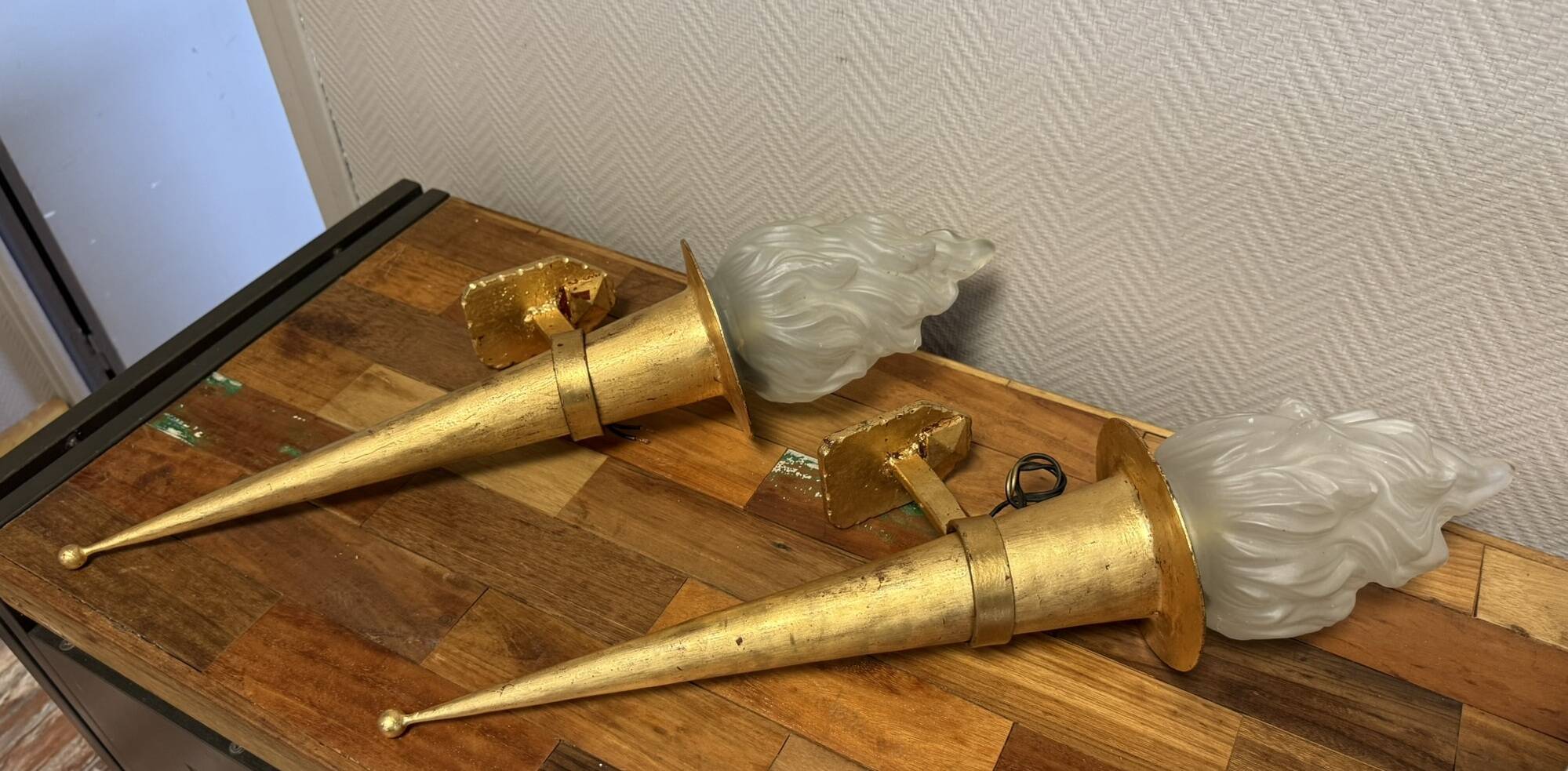 Pair of large medieval-style torchiere lamps in gilded metal
