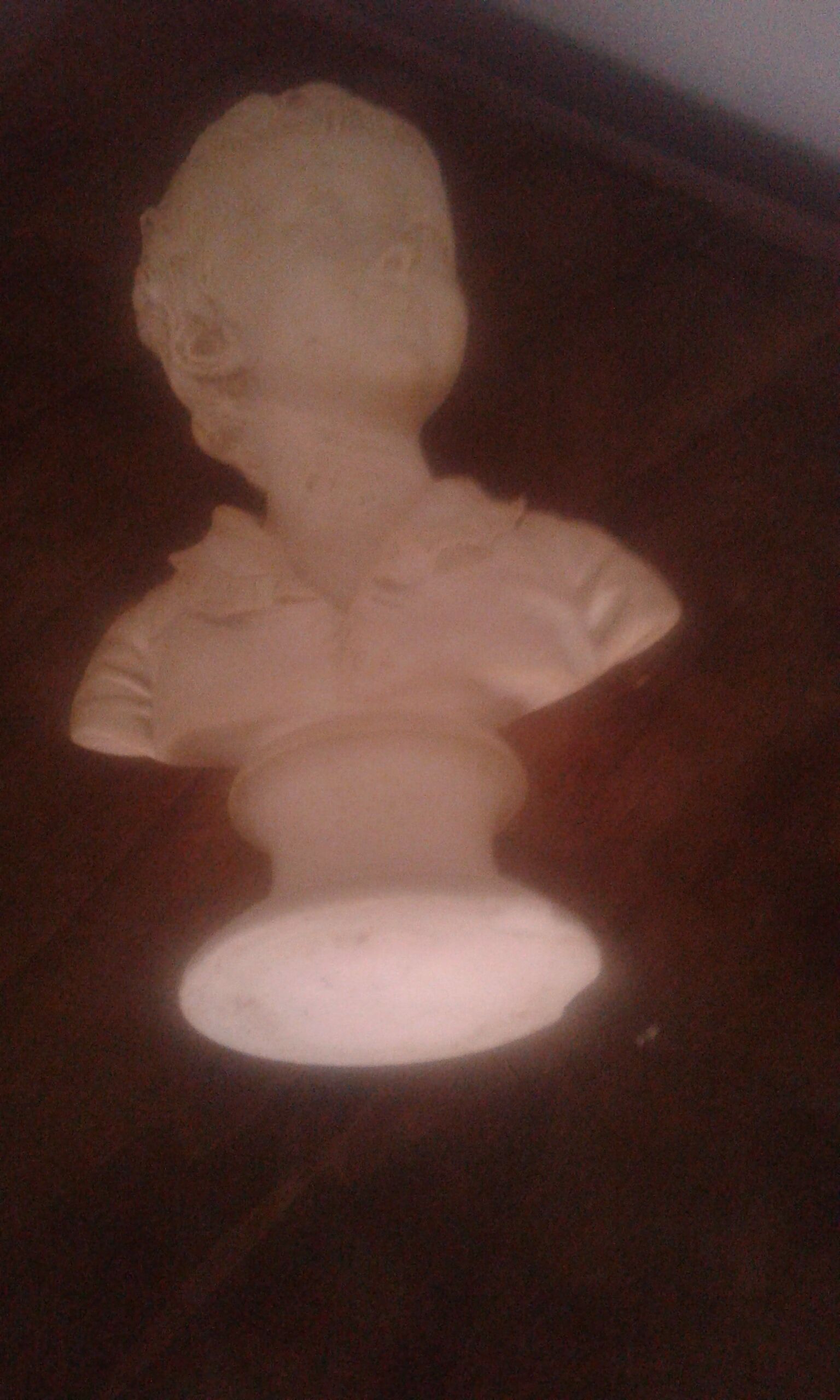 Boy bust in plaster