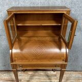Cylinder desk topped with a Louis XVI style marquetry display case
