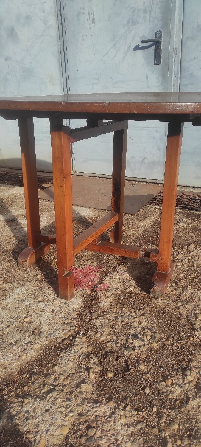 Old rustic oval folding wooden farmhouse table