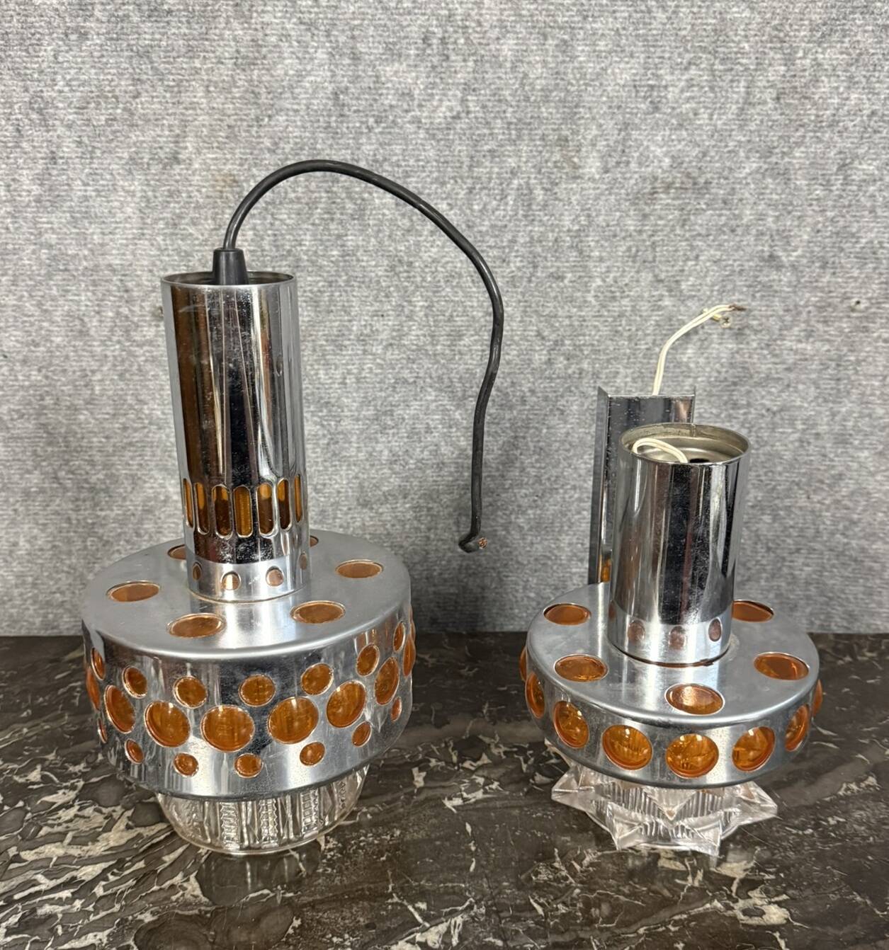Two vintage space age pendant lamps by Raak, 1970