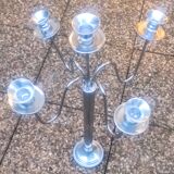 Standing candlestick in stainless steel metal with 5 movable branches, with smooth ring for 4 cm candles.