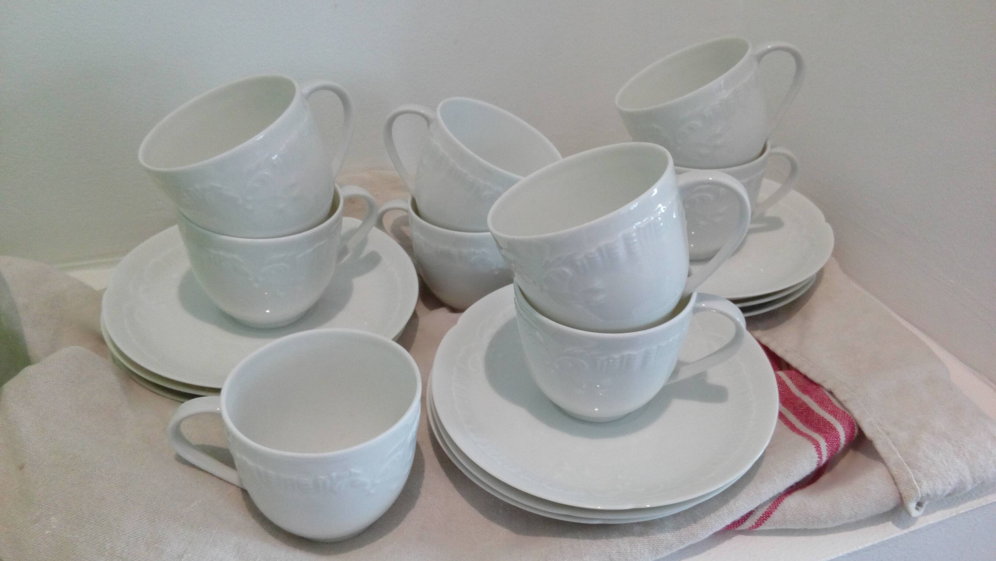 Set of 9 white porcelain coffee cups