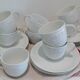 Set of 9 white porcelain coffee cups