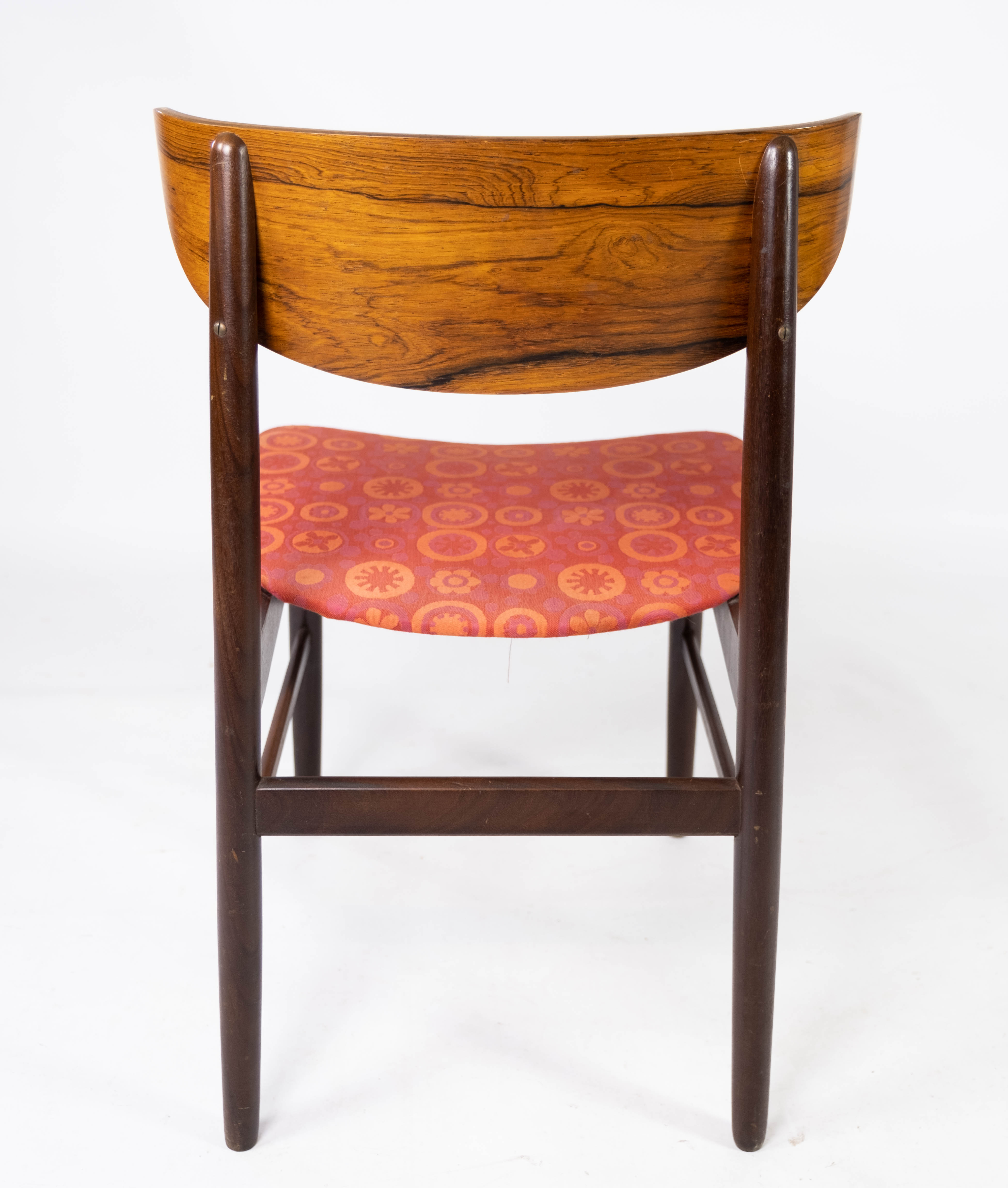 Set of four dining room chairs in rosewood and upholstered with red fabric, of danish design, 1960s