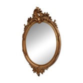 Antique oval mirror in gilded wood with gold leaf – bevelled glass –