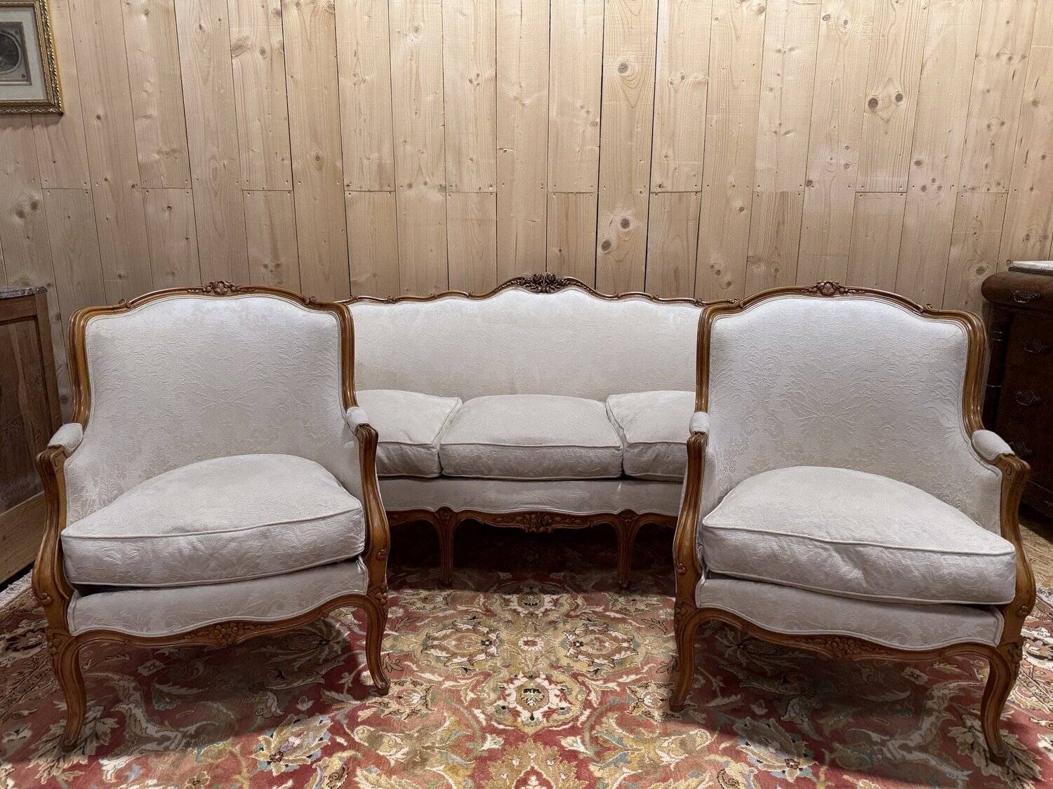 Beige Louis XV style salon sofa and pair of armchairs.
