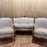 Beige Louis XV style salon sofa and pair of armchairs.