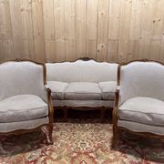 Beige Louis XV style salon sofa and pair of armchairs.