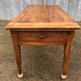 Antique solid cherry farmhouse table with 2 end drawers and 1 pull-out.