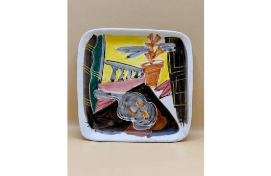 Decorative ceramic plate with enamel decoration