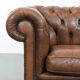 Brown cowhide leather chesterfield armchair  in English style on wheels