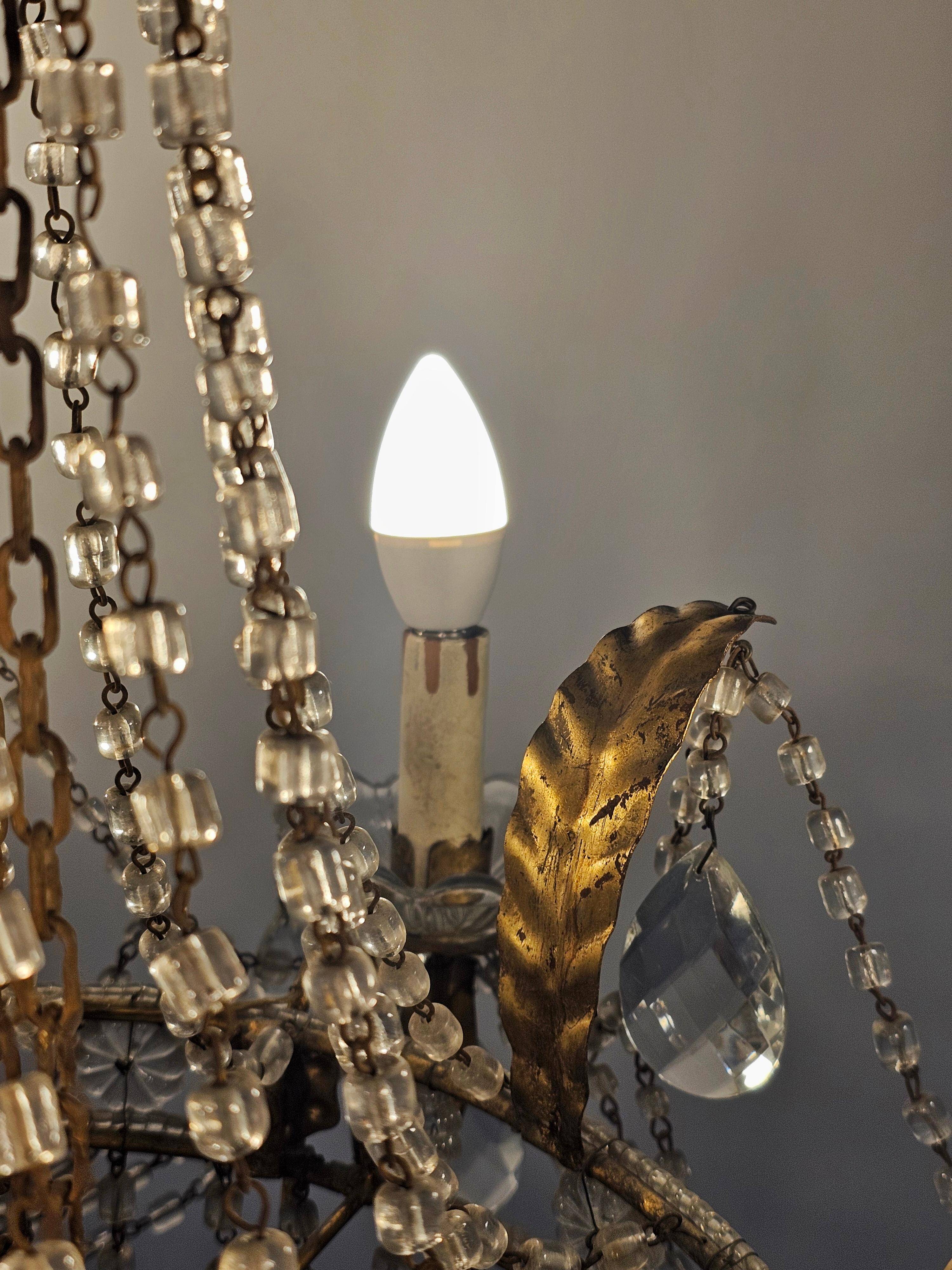 Antique crystal chandelier with floral details 1910