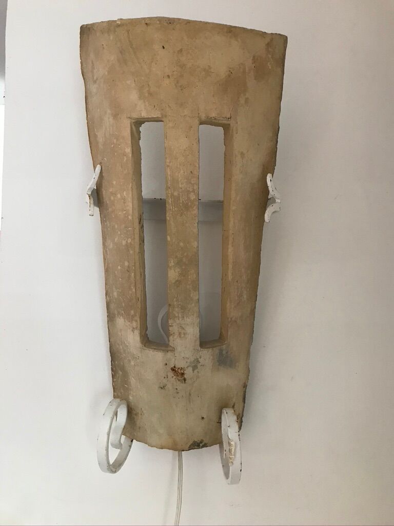 Lot of three terracotta and wrought iron appliques