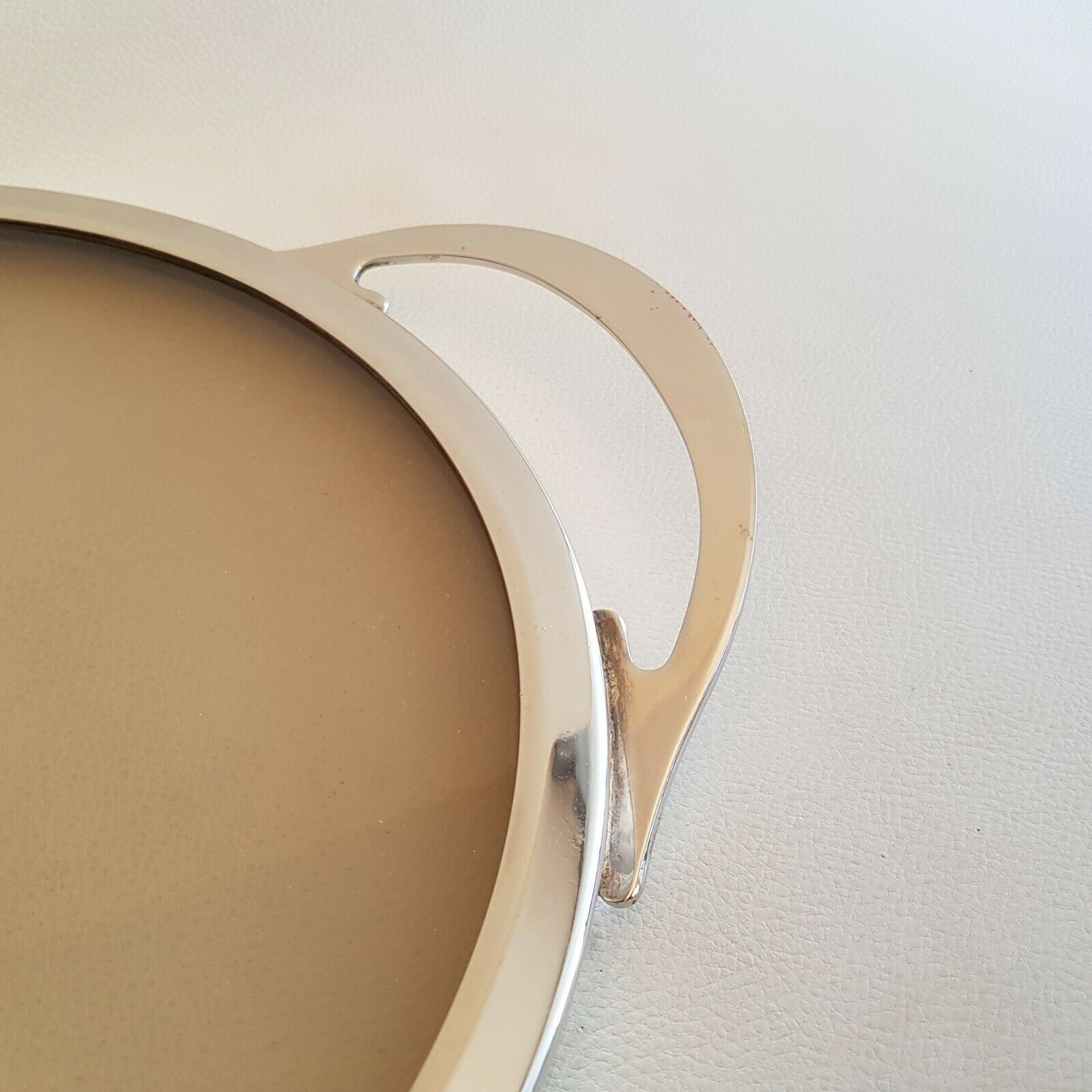 Round glass and art deco silver metal tray