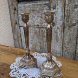 Pair of chiseled metal candle holders