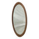 Oval beveled mirror surrounded by light wood dimension: height -74,5cm- width -38,5cm- prof-2cm-