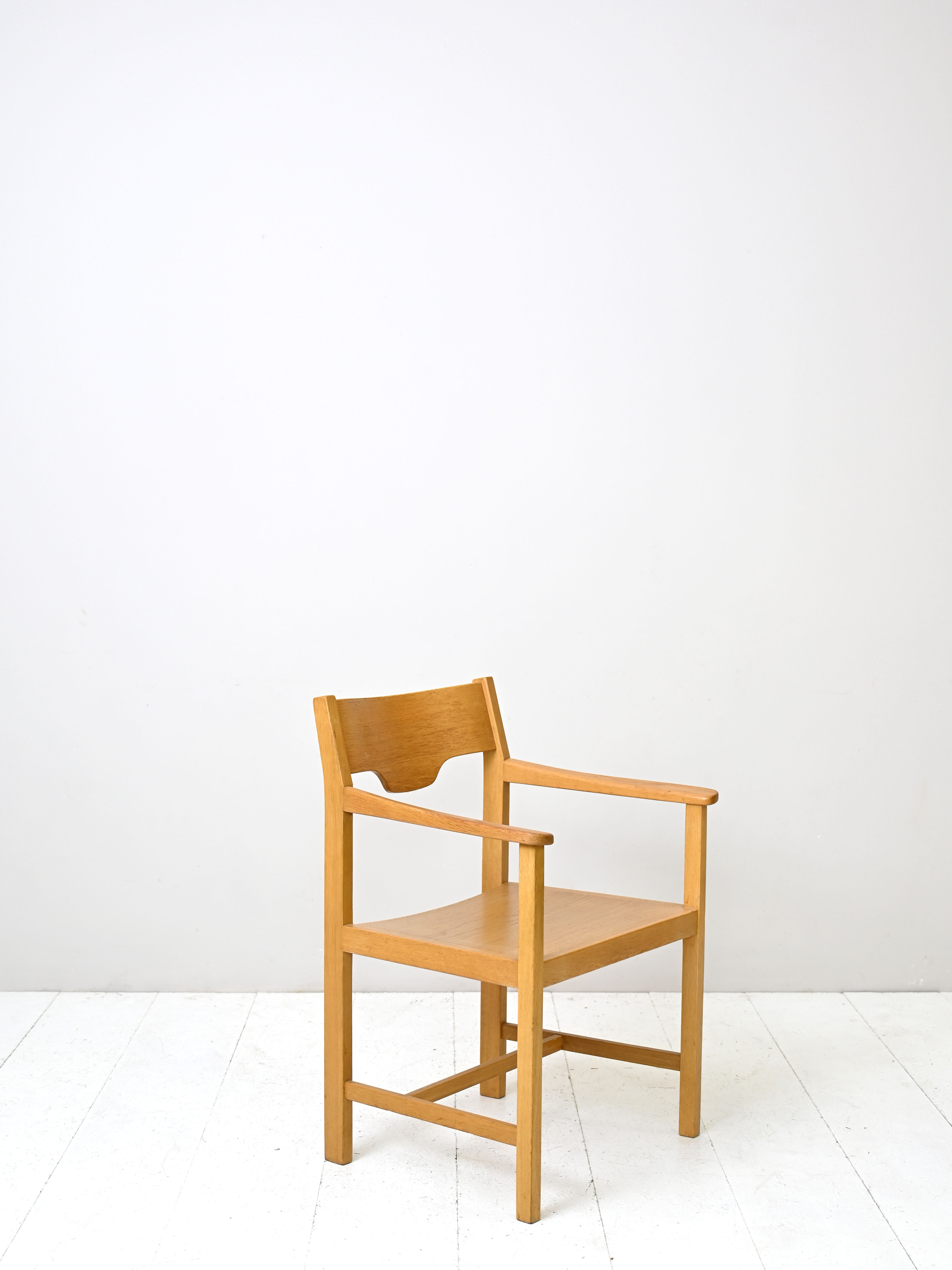 Wooden chair with armrests