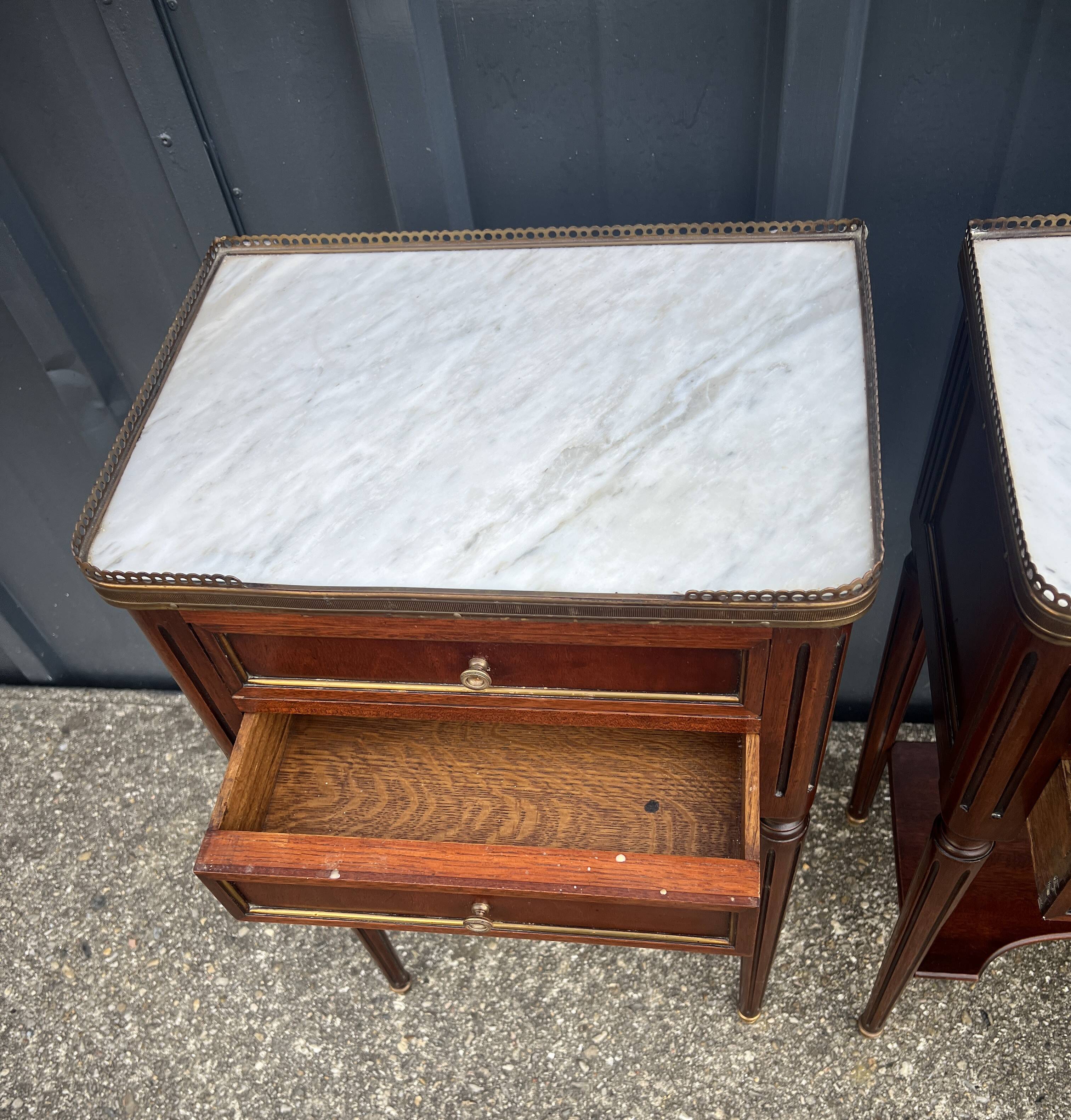 Pair of mahogany bedside tables, marble top, Louis XVI style
