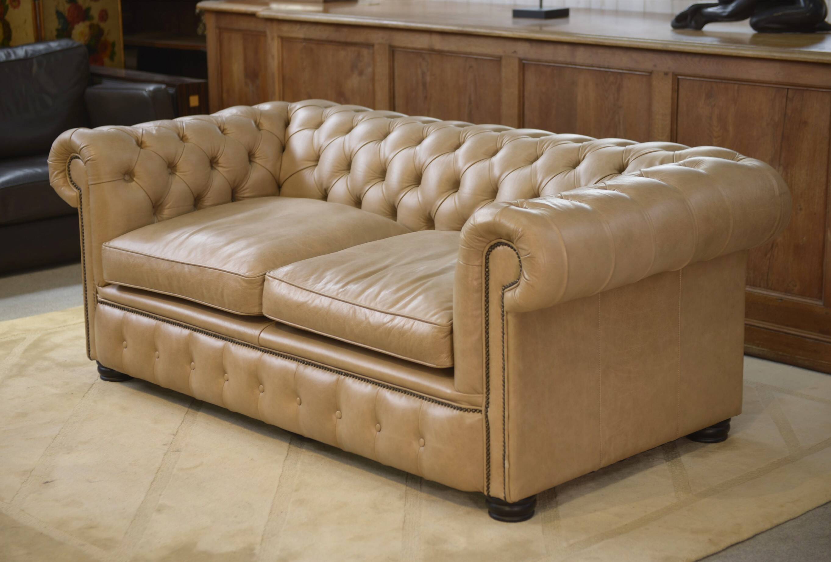Beige leather Chesterfield sofa handmade in England.