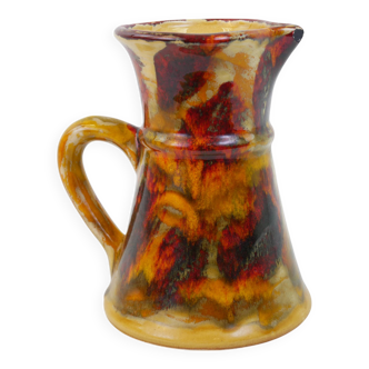 Beautiful ceramic pitcher in fire colors