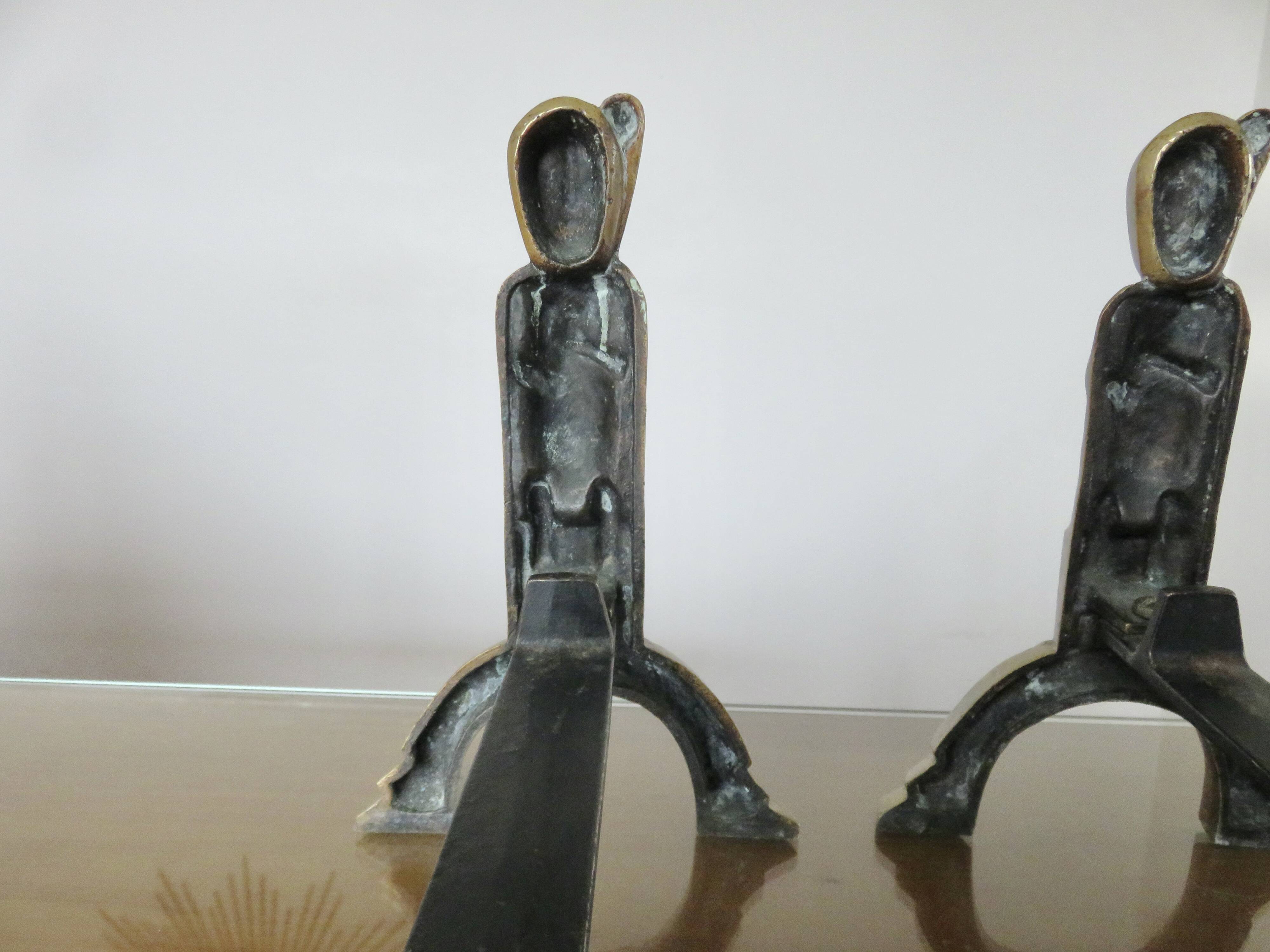 Anton Prinner, pair of Shaman fire dogs in gilded bronze, monogrammed, 1930