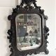 Napoleon III mirror in carved blackened wood, 19th century