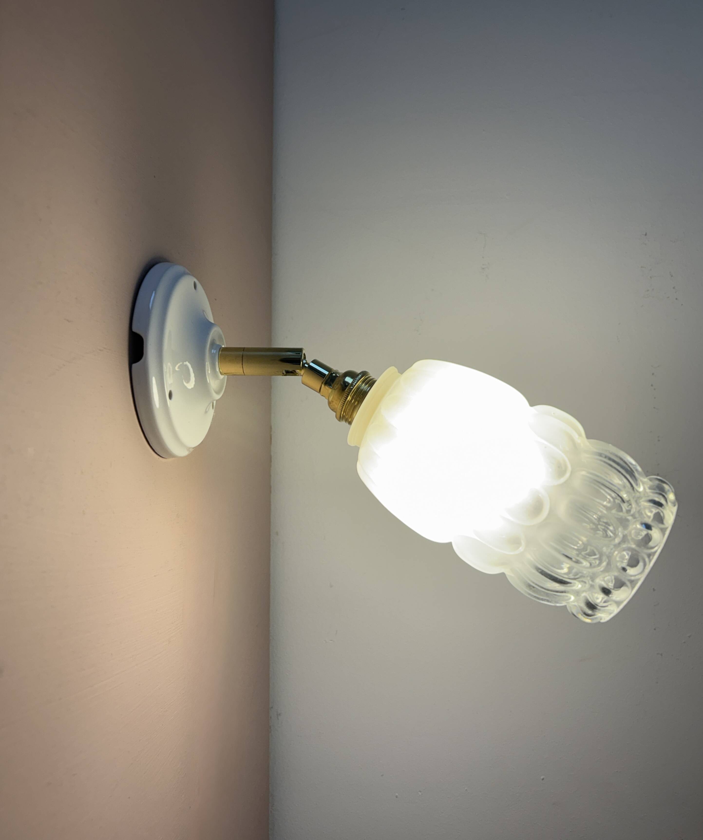 Vintage globe wall lamp in half frosted, half transparent glass