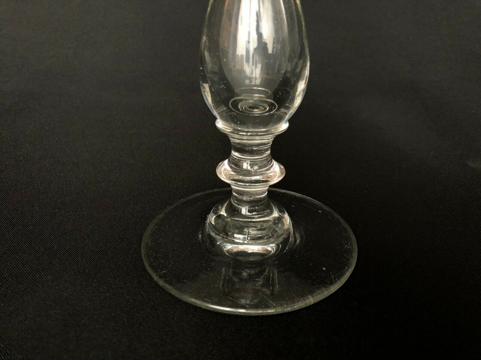 Glass oil lamp blows on foot shower