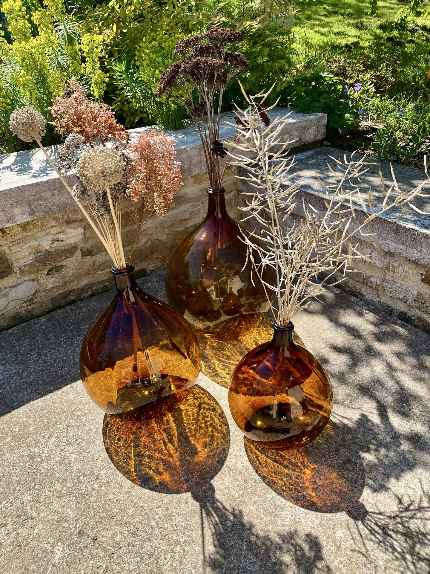 Lot de 3 dame-jeanne ambrées