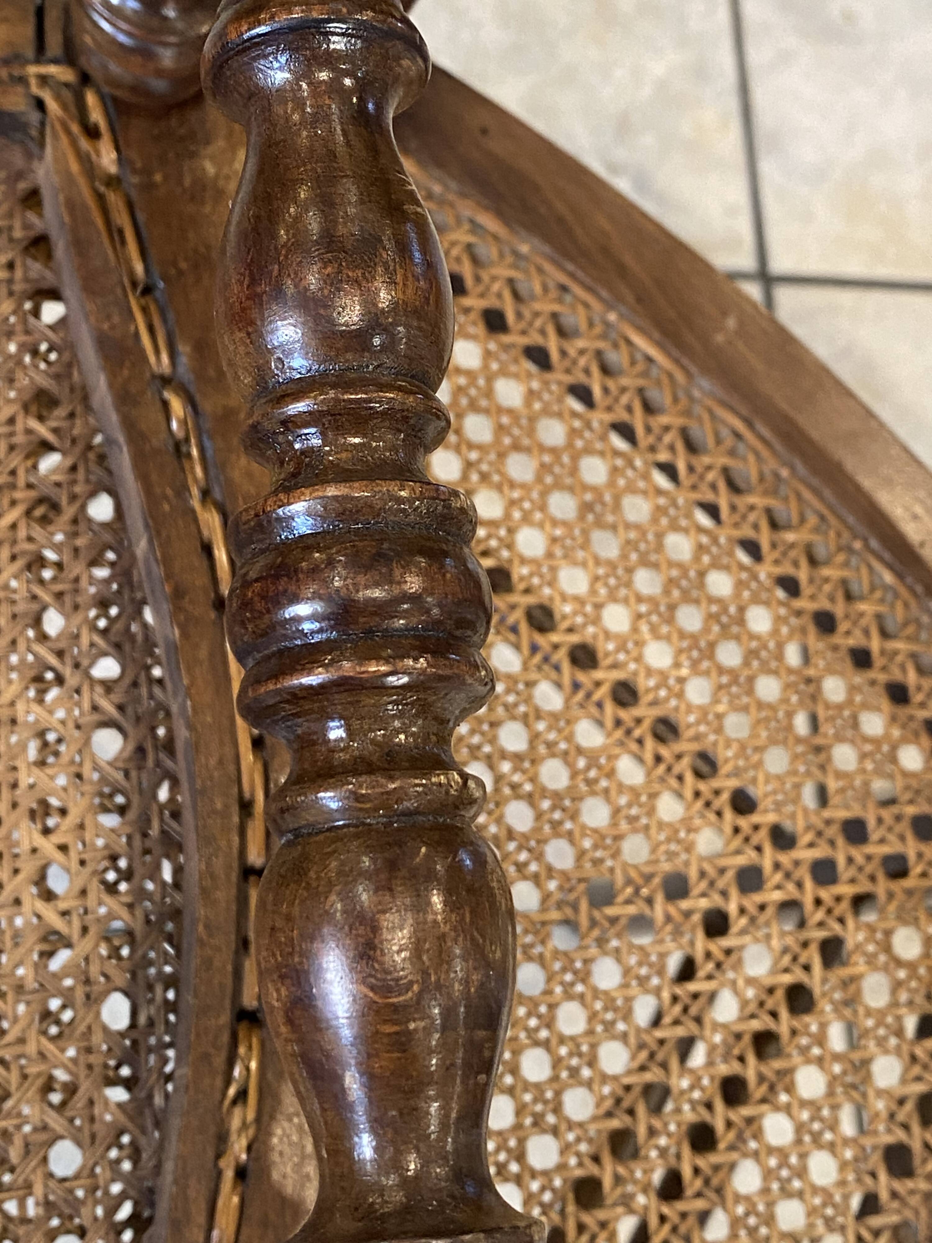 Pair of N2 antique caned and wooden chairs from the 1900s.