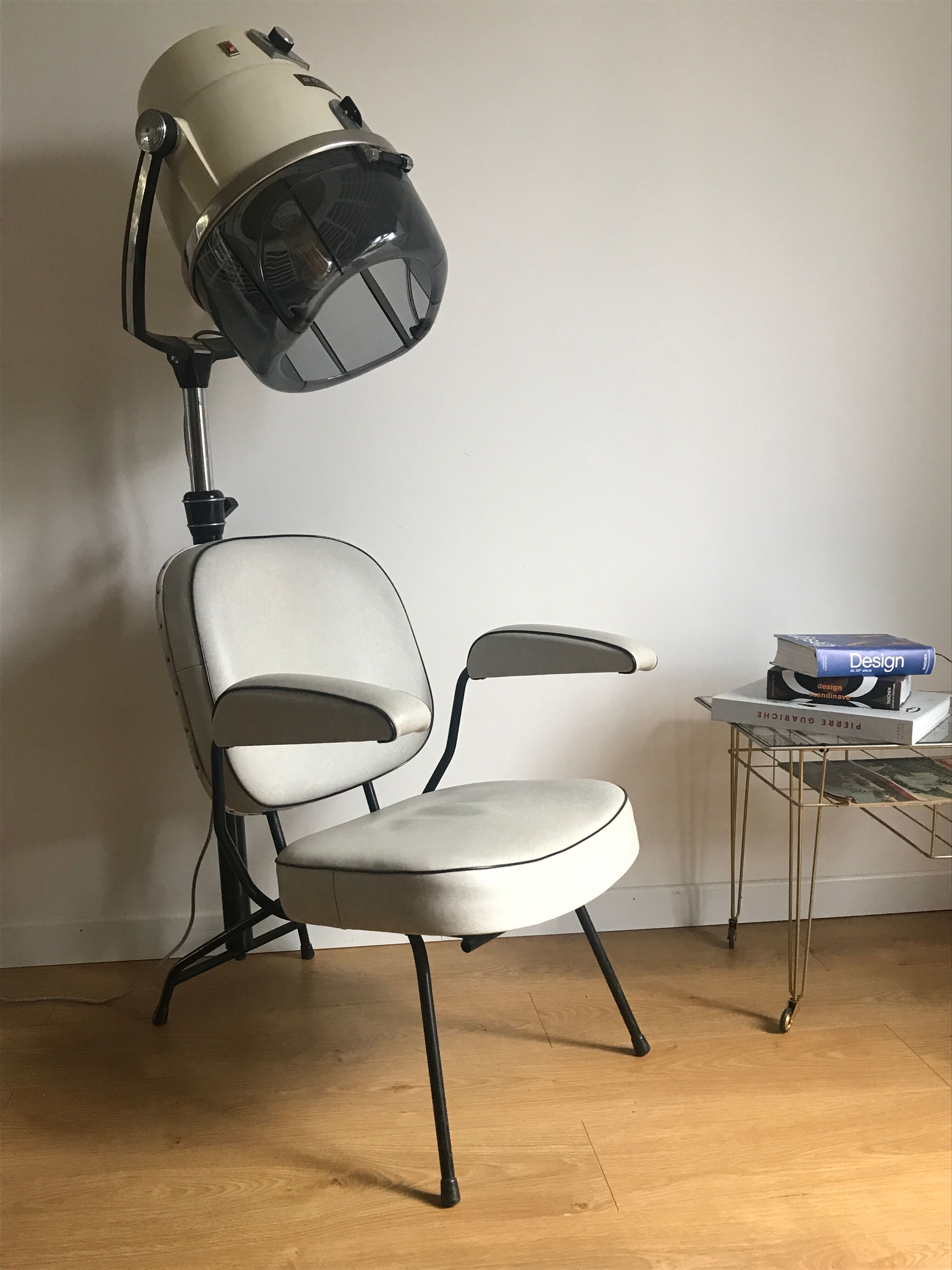 Vintage hairdresser's armchair with helmet transformed into a lamp