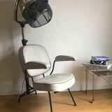 Vintage hairdresser's armchair with helmet transformed into a lamp
