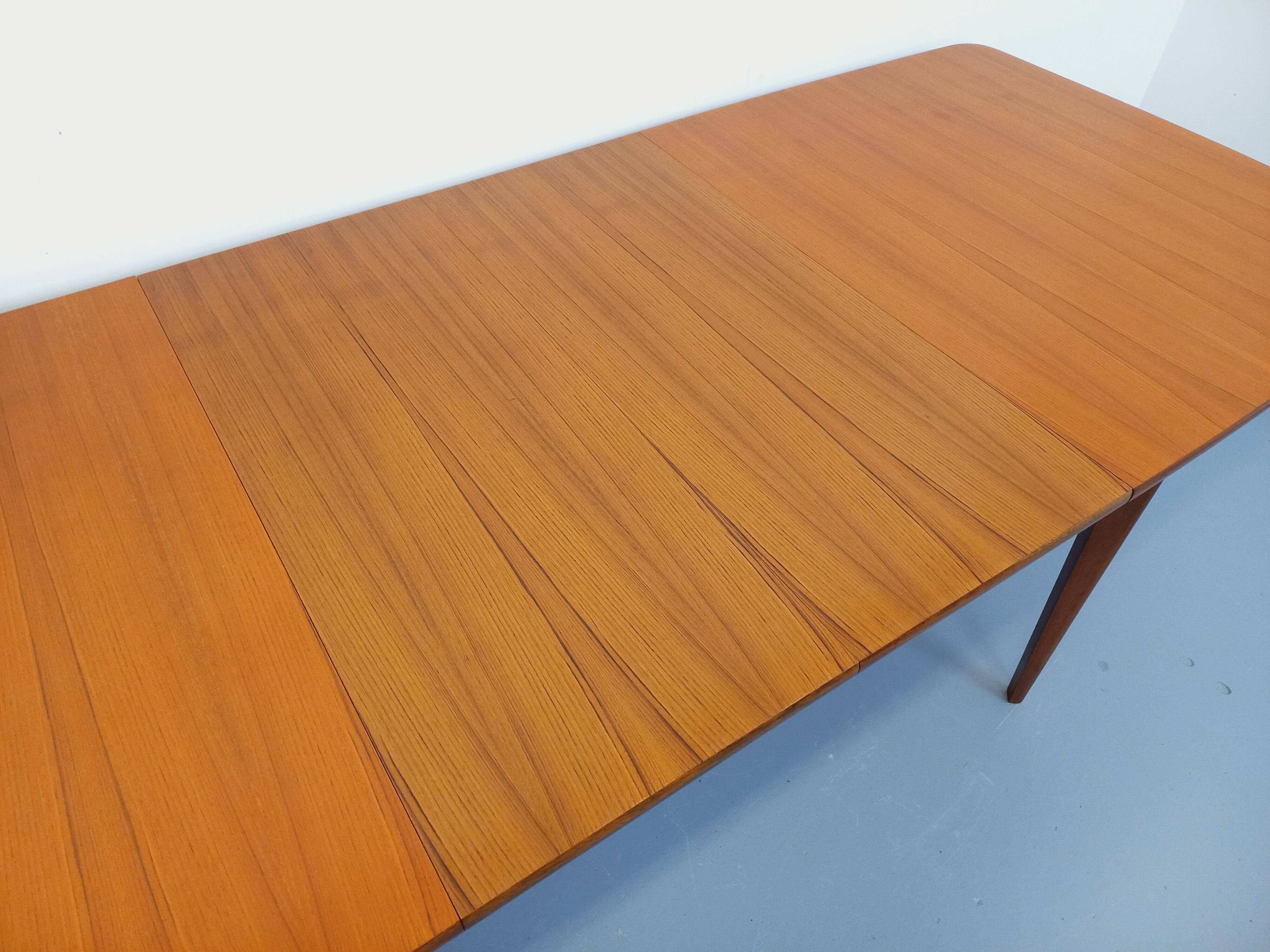 Rectangular dining table in vintage Scandinavian style from the 50s and 60s, made of teak.