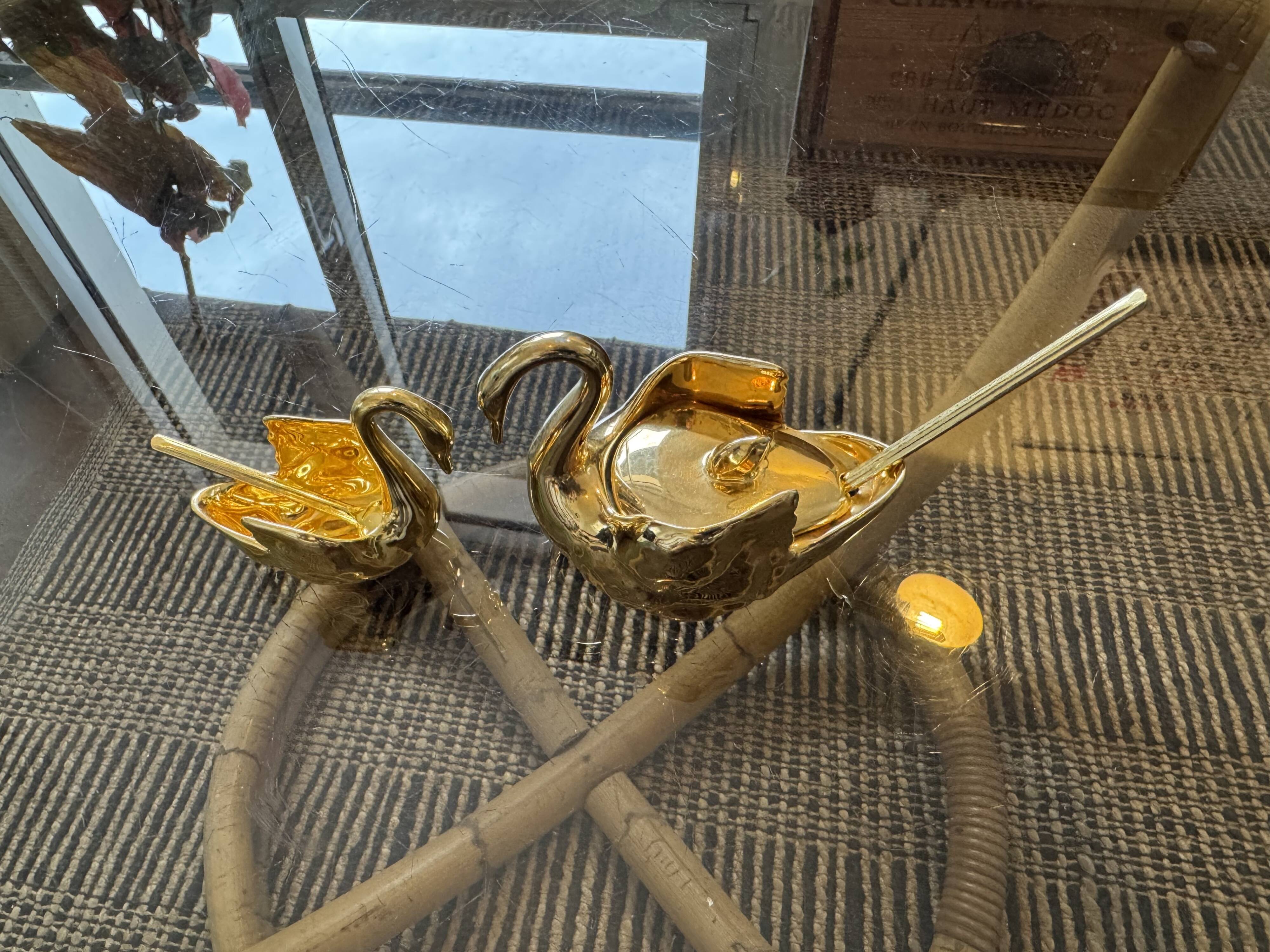 Pair of golden salt cellars in Limoges porcelain shaped like swans