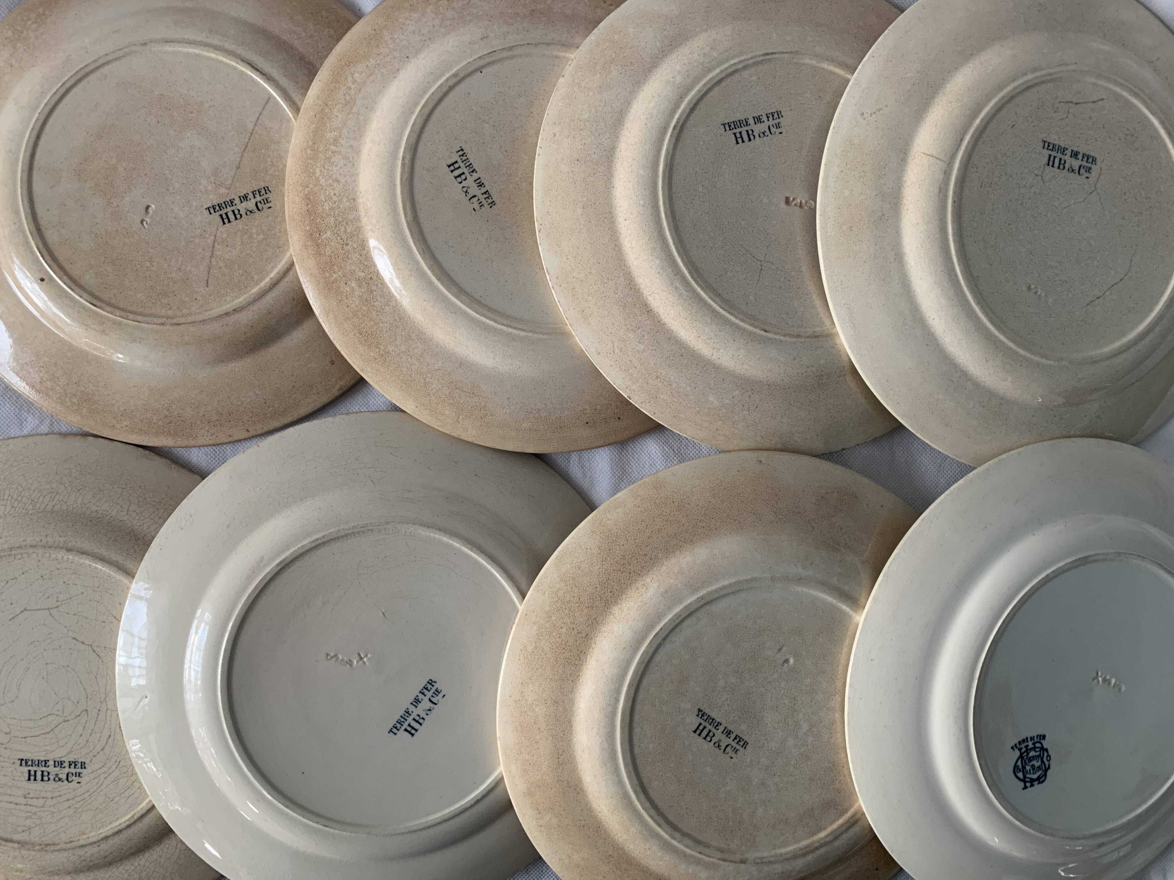8 plates and an old compoter Terre de Fer HB and Co.