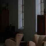 Pair of Danish Art Deco modern lounge chairs in sheepskin with lambswool and elm, 1940s.