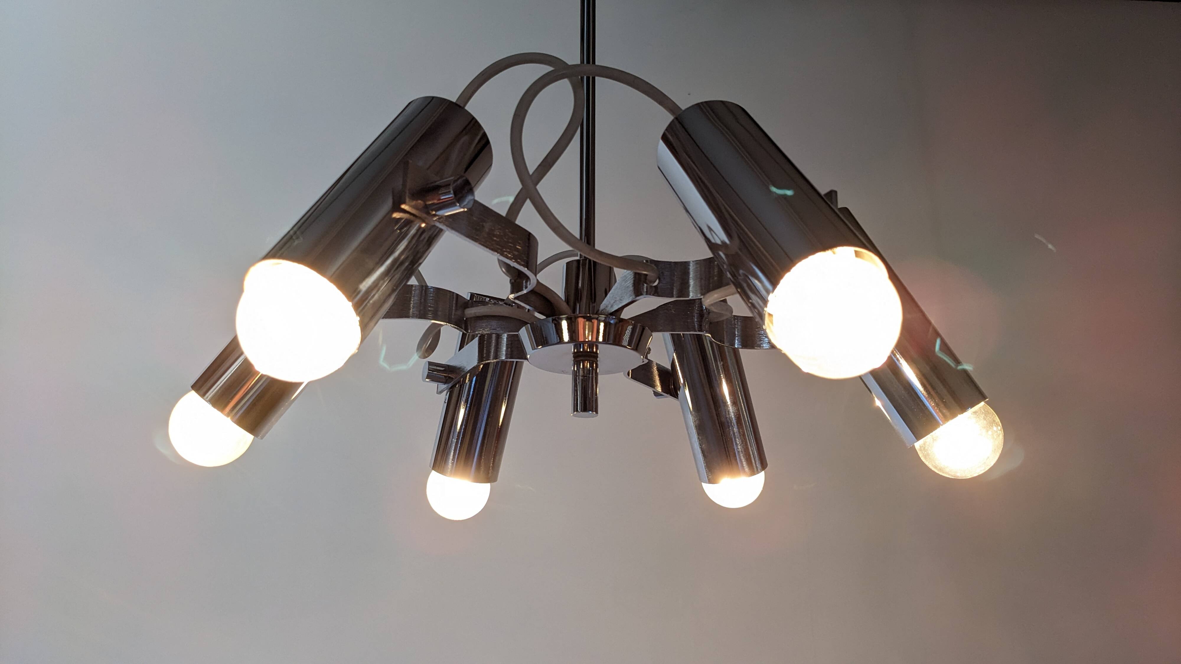 Modernist chandelier with 6 spots in chrome metal, France circa 1970.