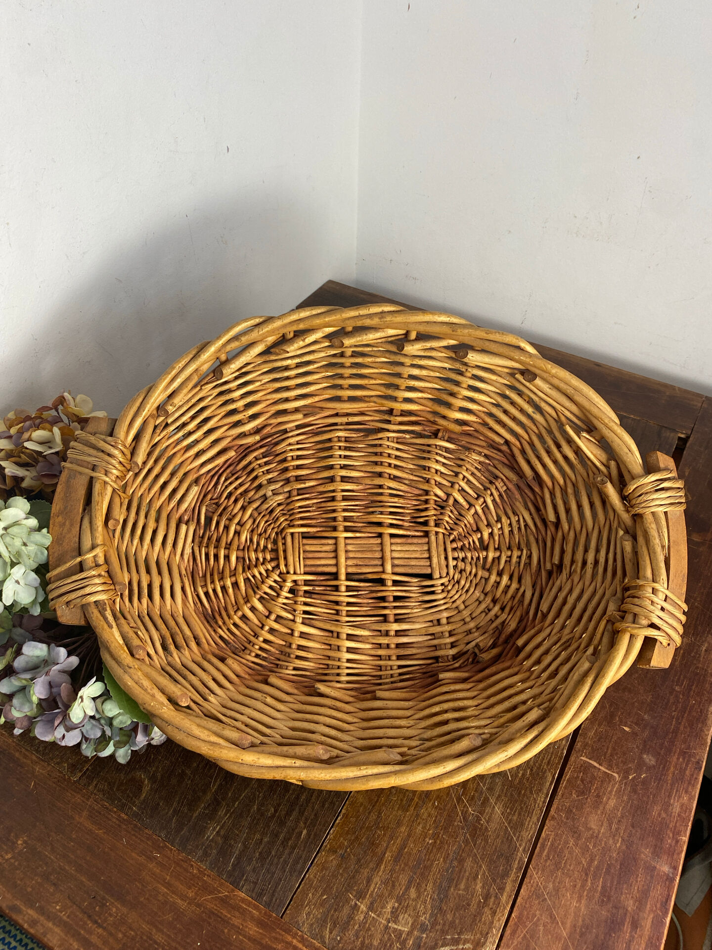 Wicker basket with wooden handles