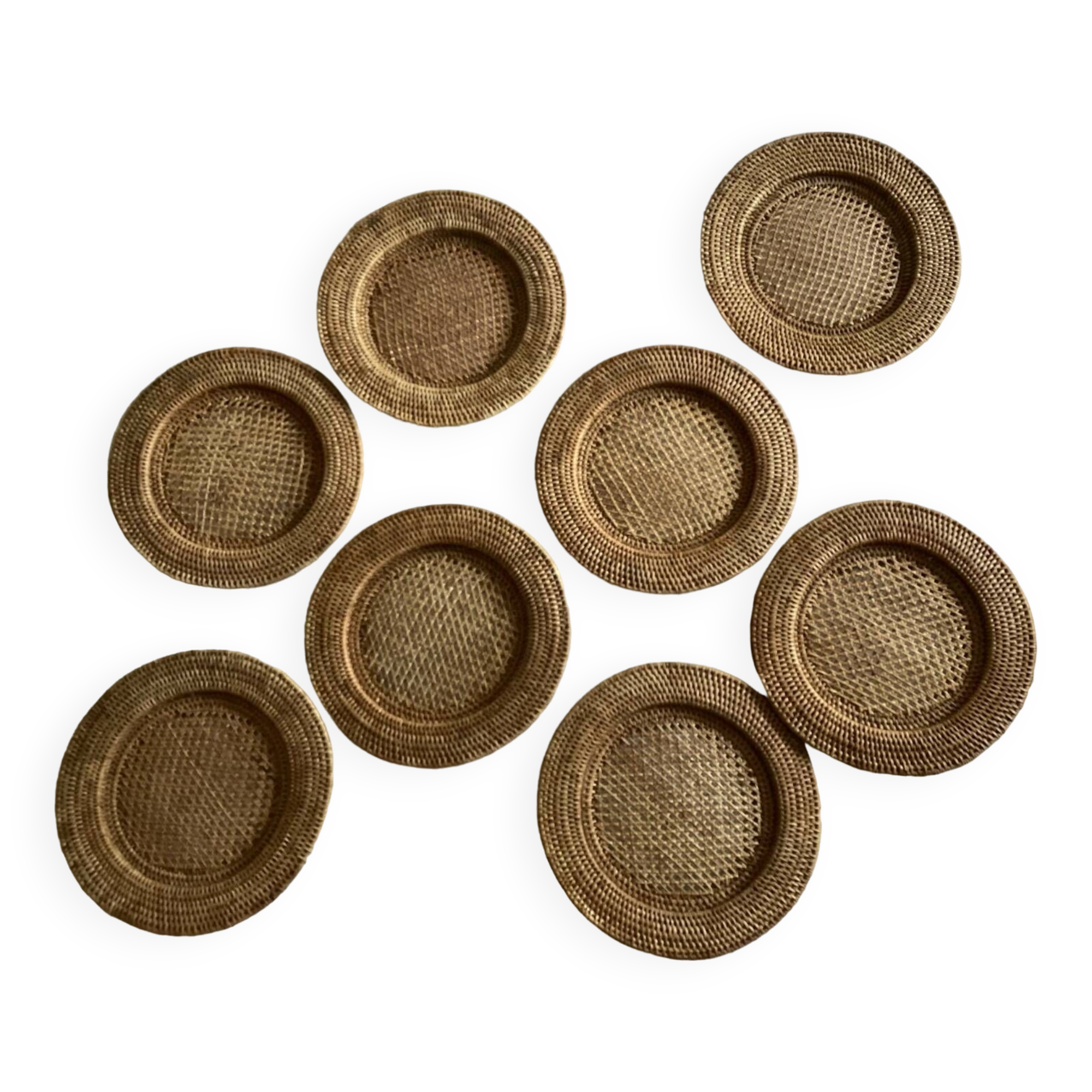 Set of round woven rattan and canework coasters