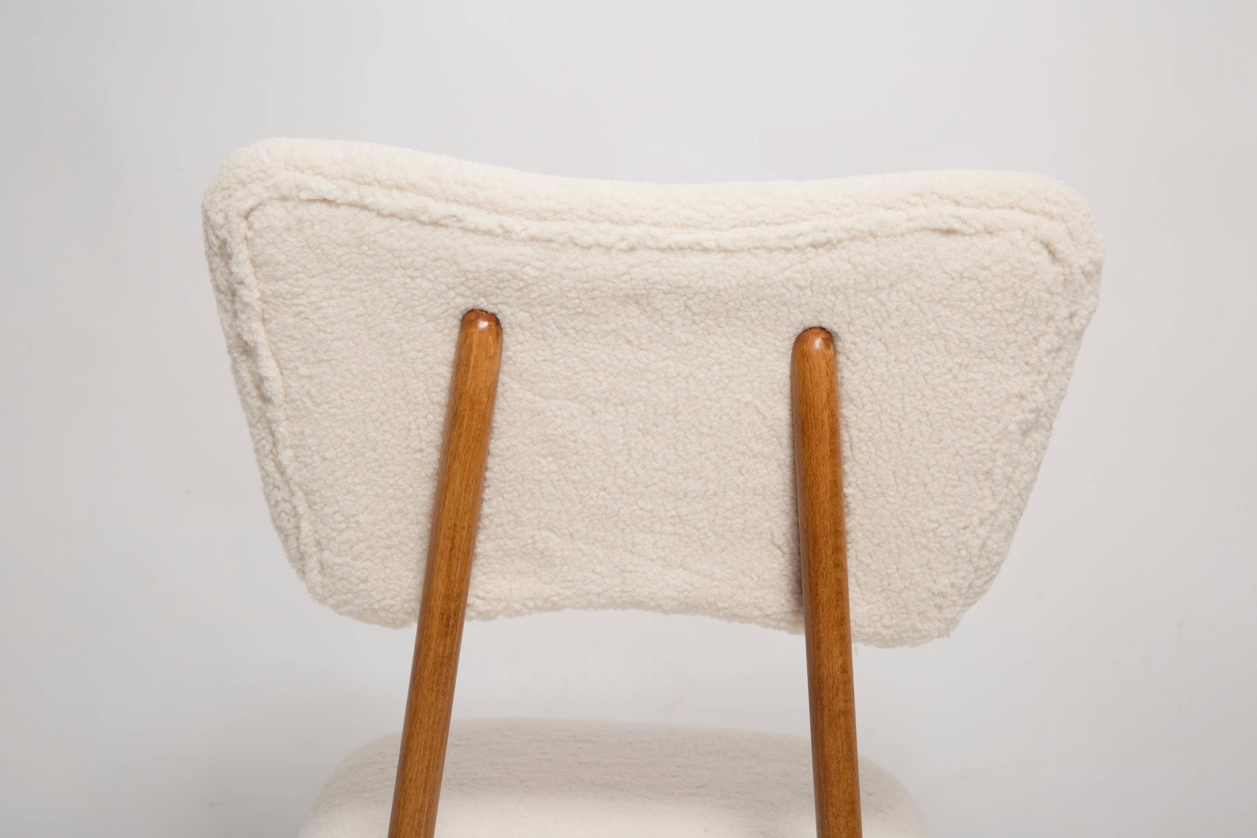 Butterfly chair in beech wood and cream boucle, Europe, 1960