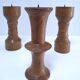 Three vintage patinated solid wood candlesticks