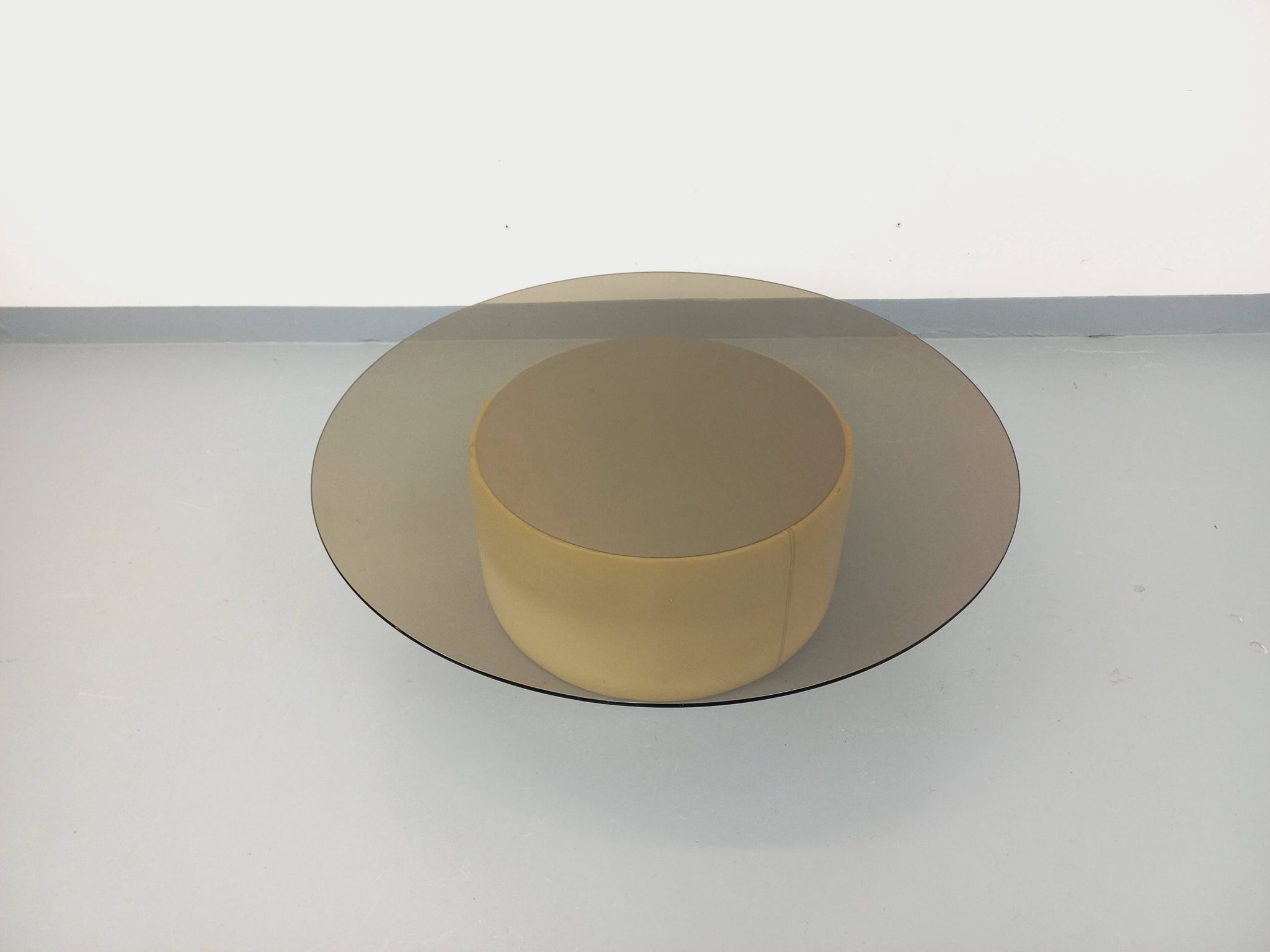 Vintage round coffee table in glass, leather, and metal in Space Age style from the 70s.