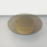 Vintage round coffee table in glass, leather, and metal in Space Age style from the 70s.