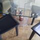 For sale: bevelled glass table and Artedi leather chairs.