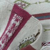 Tribal bohemian kilim rug with geometric pattern in wool.